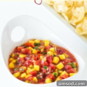 Freshly made mango salsa in a bowl with tortilla chips