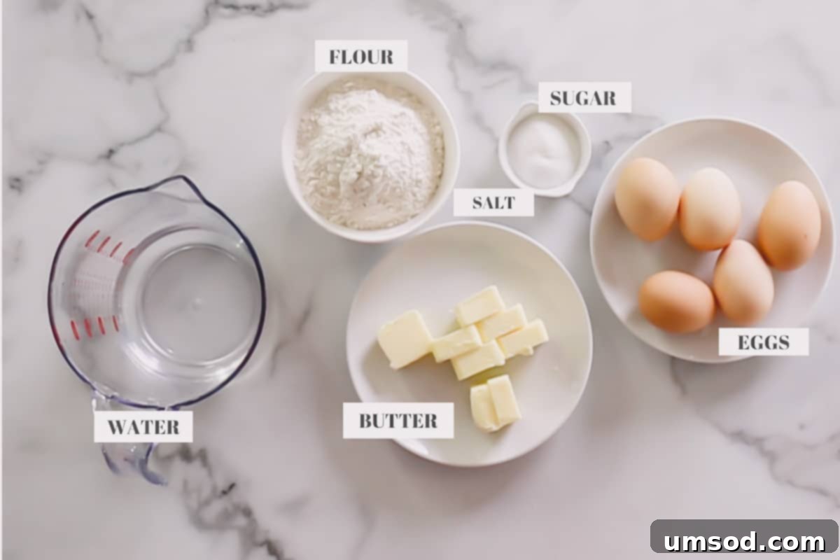 Decadent Chocolate Eclairs 5 An array of ingredients laid out, including flour, butter, sugar, salt, and eggs, ready for eclair dough preparation.