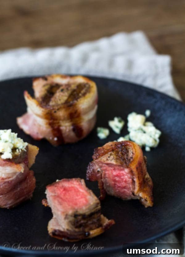 Elegant Filet Mignon Medallions 5 Platter of finished Bacon-Wrapped Mini Filet Mignons with Blue Cheese, garnished