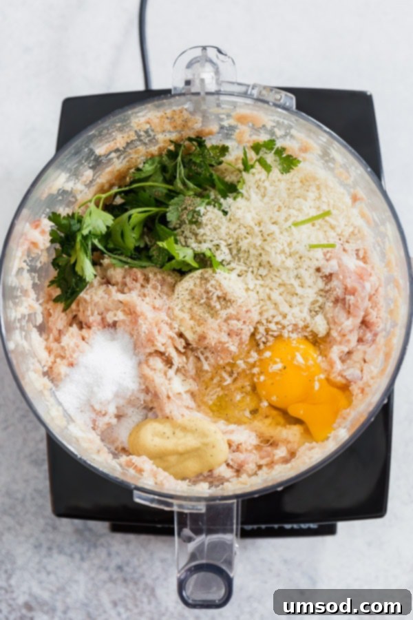 Cooked bacon chicken meatballs on a baking sheet, ready to serve