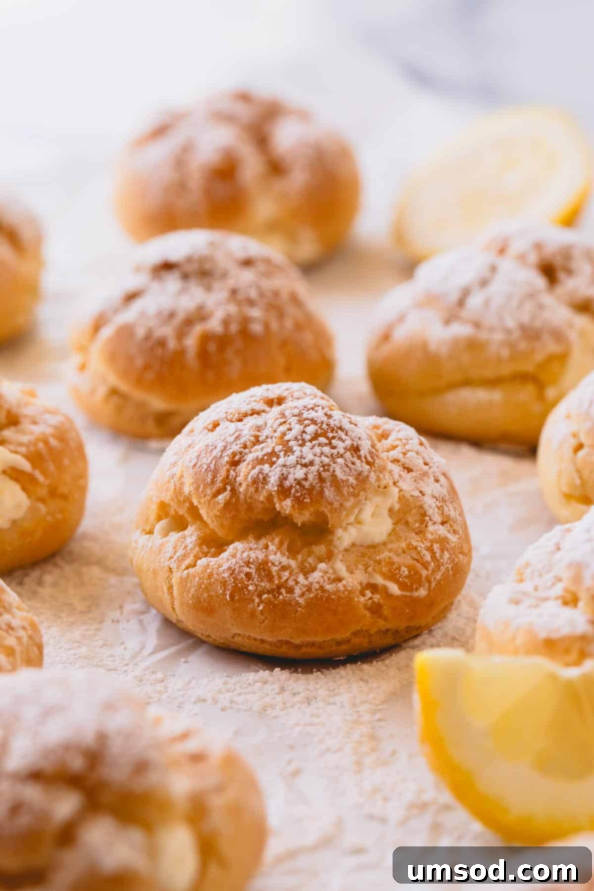 Zesty Lemon Cloud Puffs 15 A tempting platter of lemon creme puffs beautifully topped with powdered sugar.