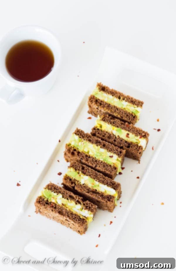 Chili-Kissed Avocado Egg Bites 5 Spicy avocado egg salad sandwiched between chewy pumpernickel bread slices. Perfect texture contrast and flavor combination!