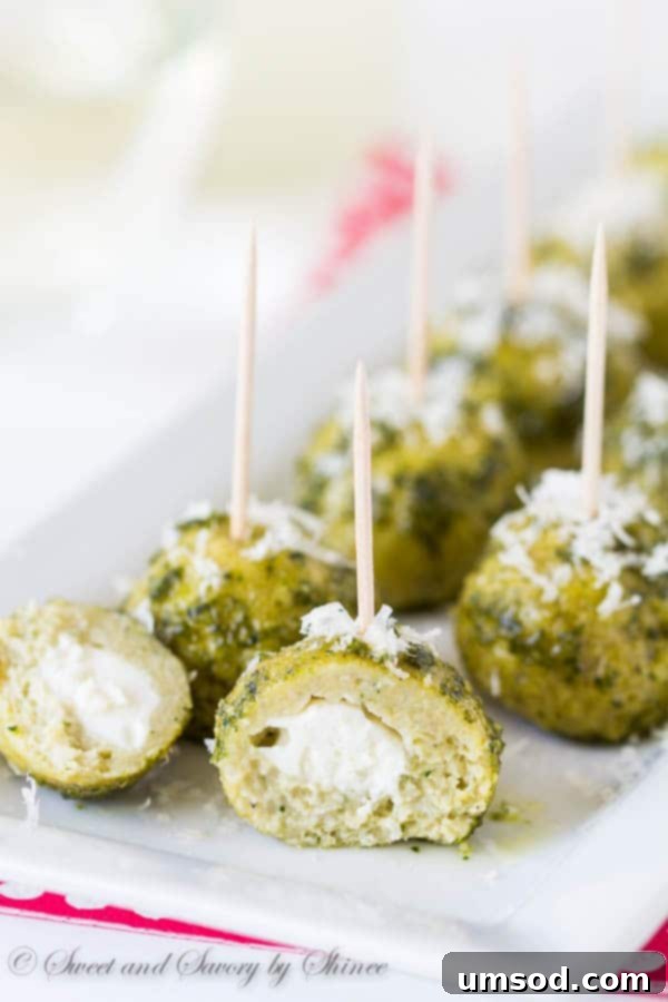 Cheesy Pesto Chicken Meatballs 5 Cooked pesto mozzarella chicken meatballs, showcasing the melted cheese inside.