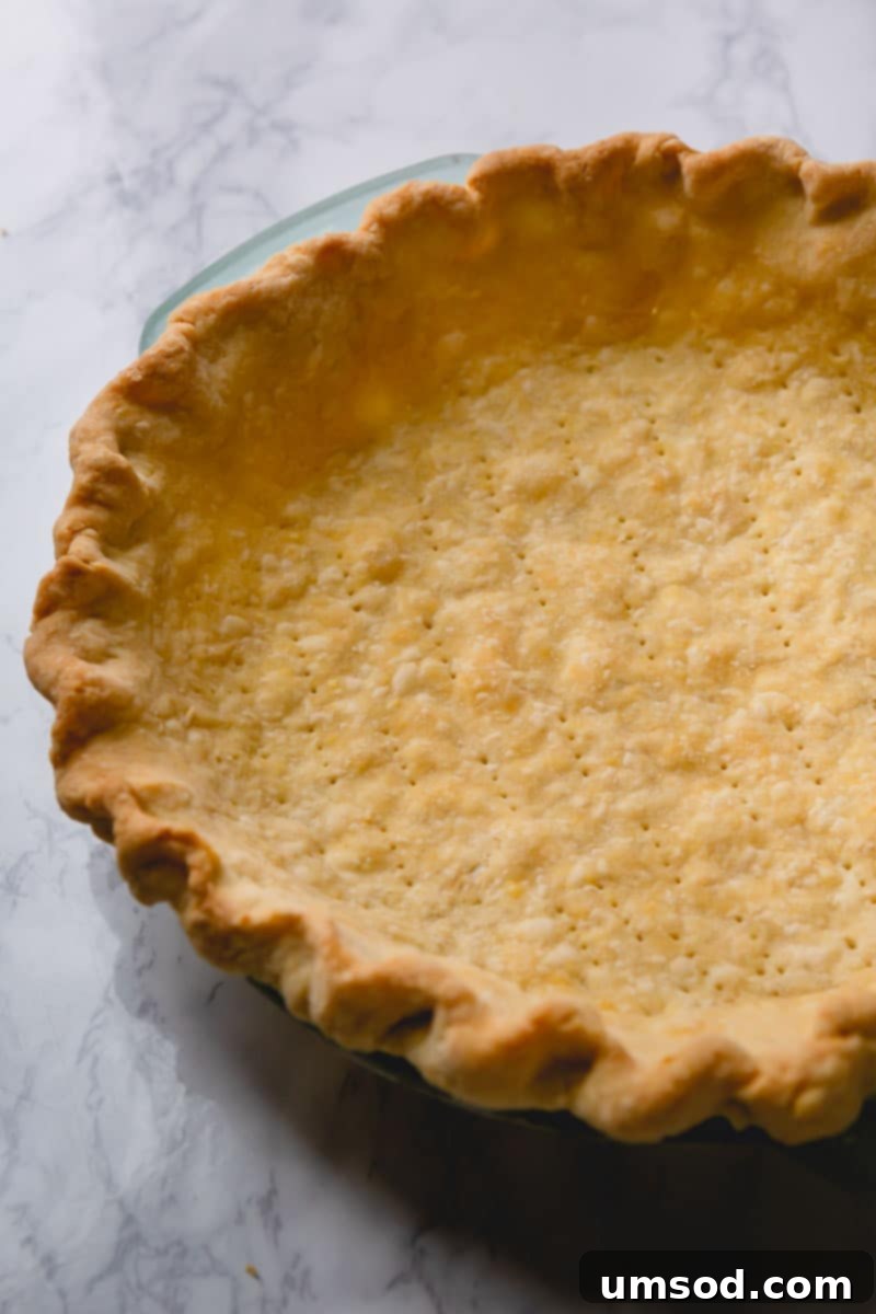A perfectly blind-baked golden-brown pie crust ready for filling.