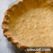 A freshly baked pie with a golden, crimped crust.