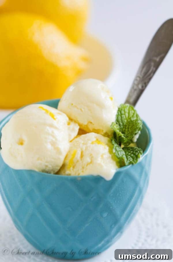 Sunshine Lemon Bliss 4 A refreshing bowl of homemade lemon ice cream, glistening with cold, ready to be enjoyed on a warm day.