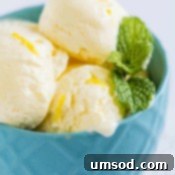 Sunshine Lemon Bliss 8 Scoops of creamy lemon ice cream in a serving bowl, garnished with lemon slices and fresh mint, ready to be devoured.