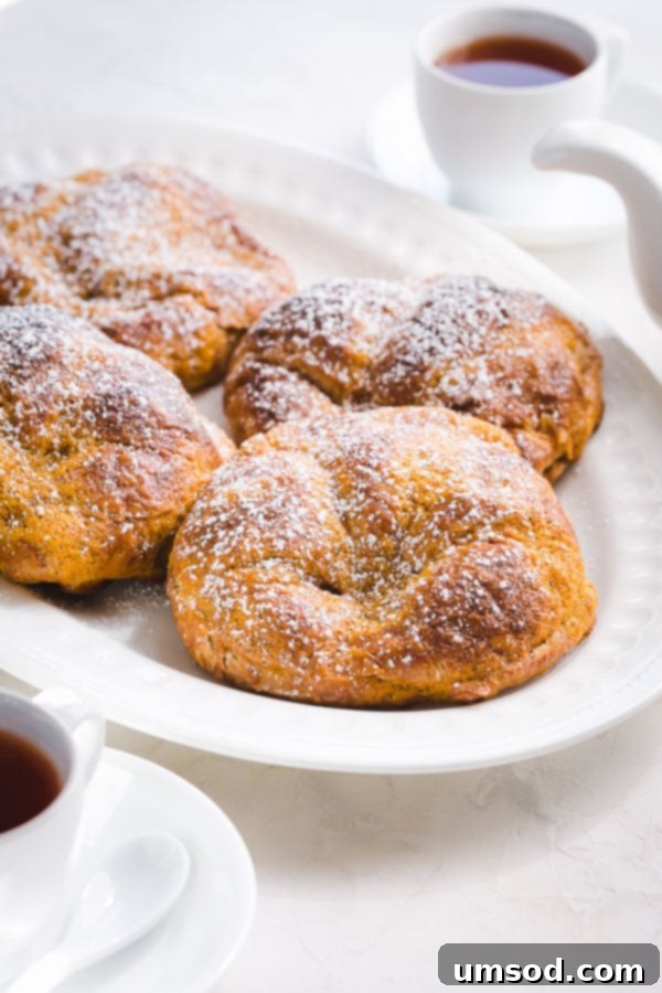 Freshly baked pumpkin croissants, a perfect fall dessert ready in under 30 minutes. Enjoy with your morning coffee! #pumpkineverything #pumpkindessert #pumpkincroissant