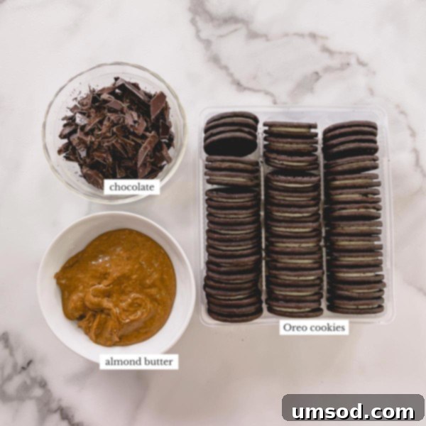 The ingredients laid out for making Oreo balls without cream cheese, featuring a jar of peanut butter as the alternative binder.