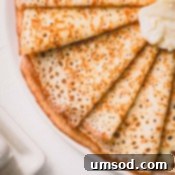 Crepe batter being poured into a pan.