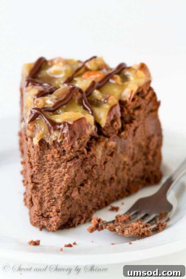 A beautifully frosted German chocolate cheesecake slice, revealing its creamy chocolate layers and decadent topping.