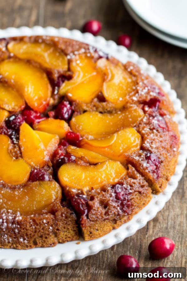 Close-up of baked Apple Cranberry Upside Down Coffee Cake with caramelized fruit