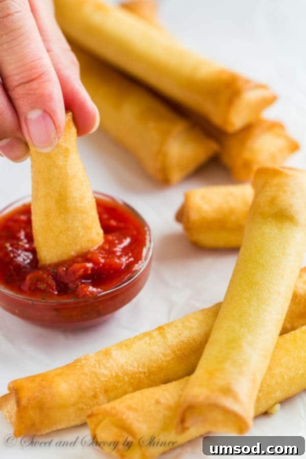 Effortless Mozzarella Sticks 6 A platter of golden-brown 3-ingredient mozzarella sticks ready to be served.