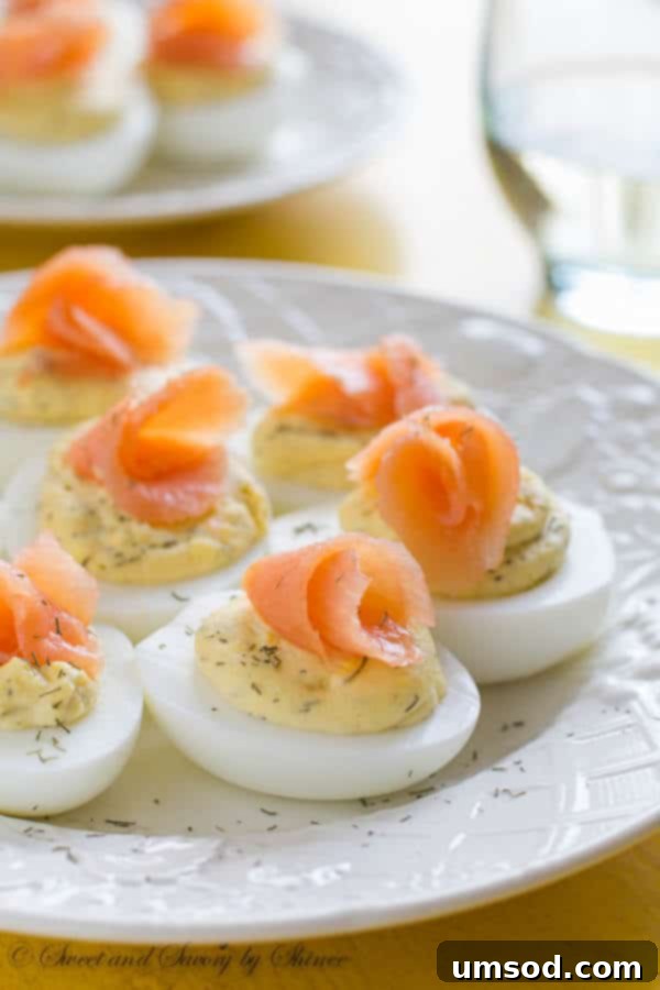 Beautifully garnished Smoked Salmon Deviled Eggs arranged on a serving platter