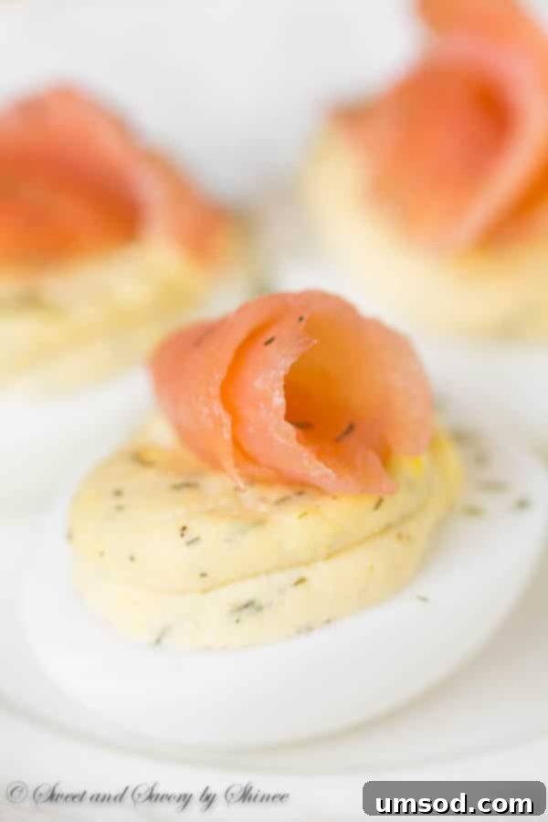 Smoked Salmon Deviled Eggs topped with delicate flakes of salmon and fresh dill