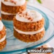 Perfectly Portioned Pecan-Topped Carrot Cakes 14 mini carrot cakes on a platter.