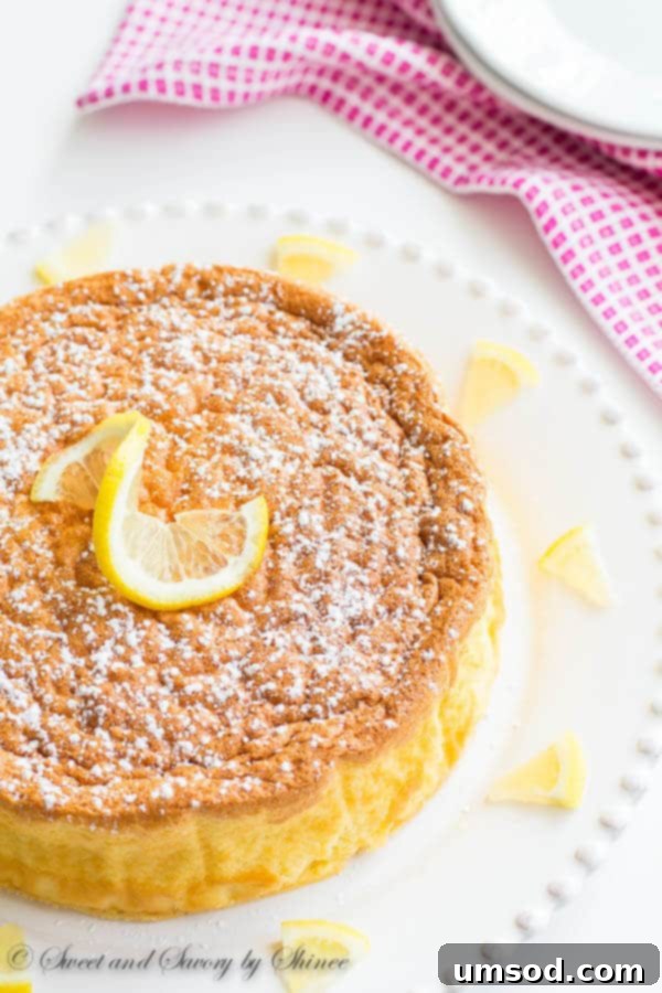 A slice of light and fluffy Lemon Soufflé Cheesecake, perfect for a spring dessert