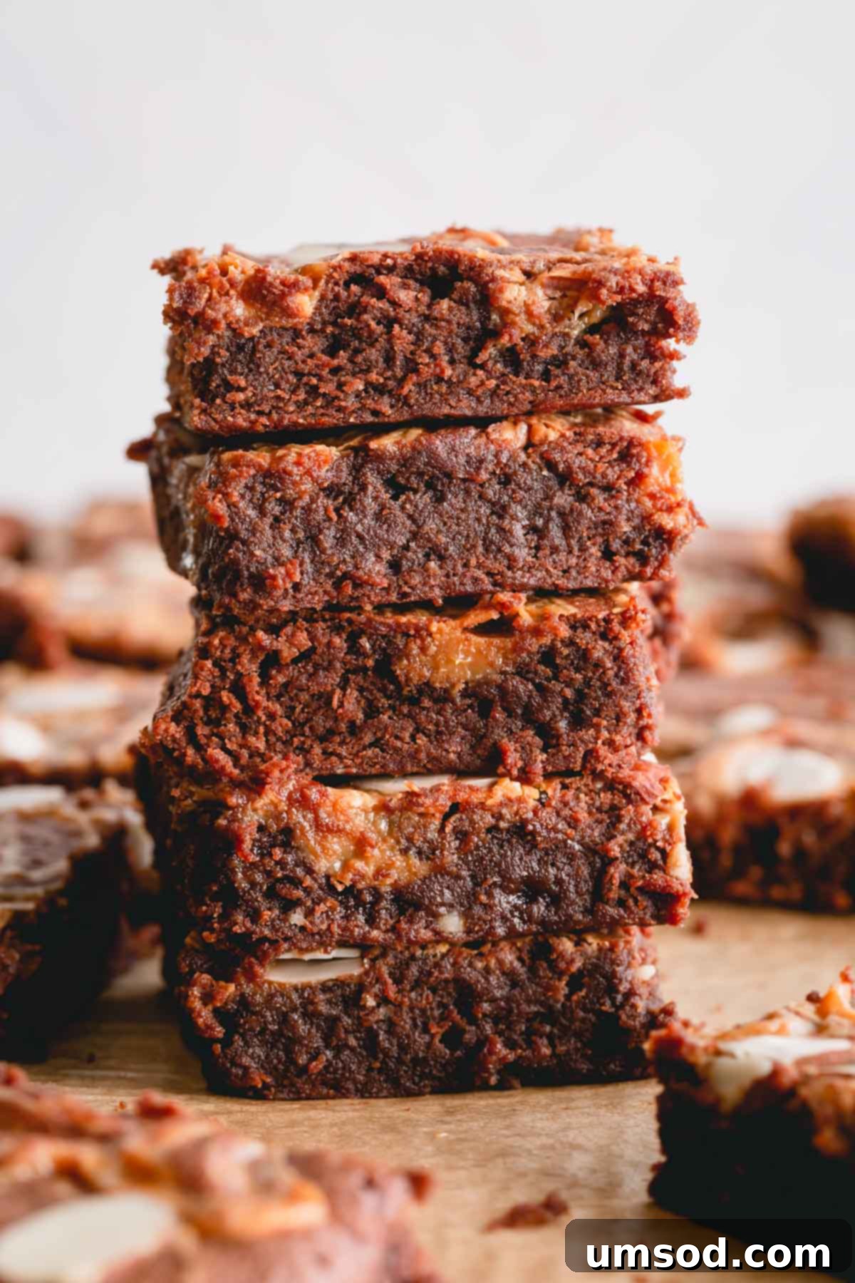 Dulce De Leche Swirled Almond Brownies 2 A stack of rich, fudgy brownie squares, showcasing their decadent texture.
