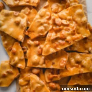 Effortless Microwave Peanut Brittle 11 Overhead view of pieces of peanut brittle.