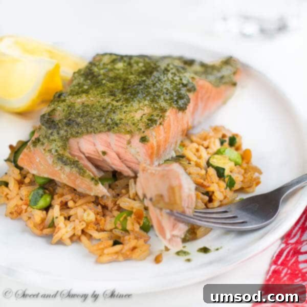 Unlock the Secret to Perfect Baked Salmon 6 Delicious baked salmon with pesto sauce, ready to be served.