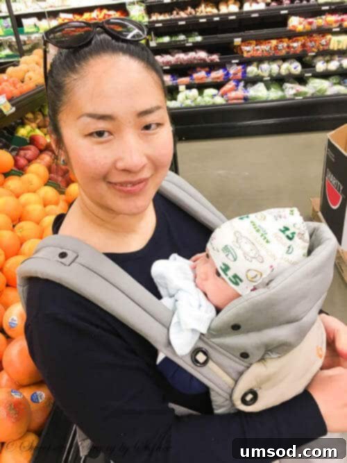 Three Months of Milestones with Baby Grant 4 Baby Grant in his car seat, enjoying his first grocery shopping trip, looking at the colorful shelves