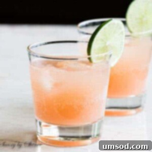 Vibrant Grapefruit Paloma 4 Freshly squeezed grapefruit paloma cocktail with a vibrant pink color.