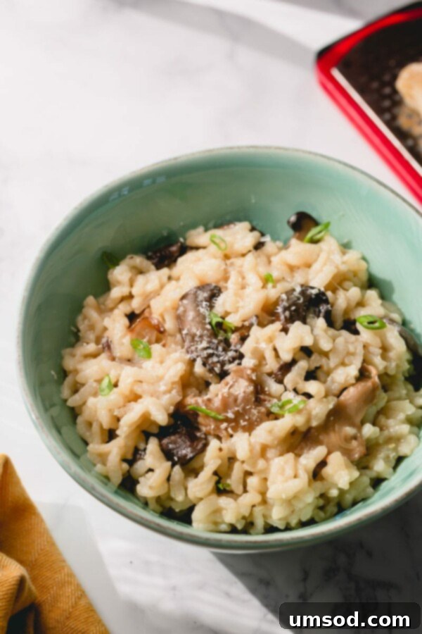 A bowl of creamy Instant Pot mushroom risotto garnished with fresh parsley.
