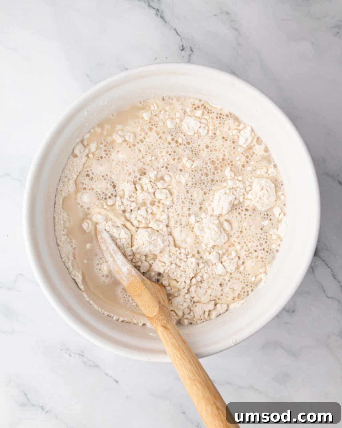 Effortless Homemade Focaccia: A Baker's Delight 6 Mixing wet and dry ingredients for focaccia