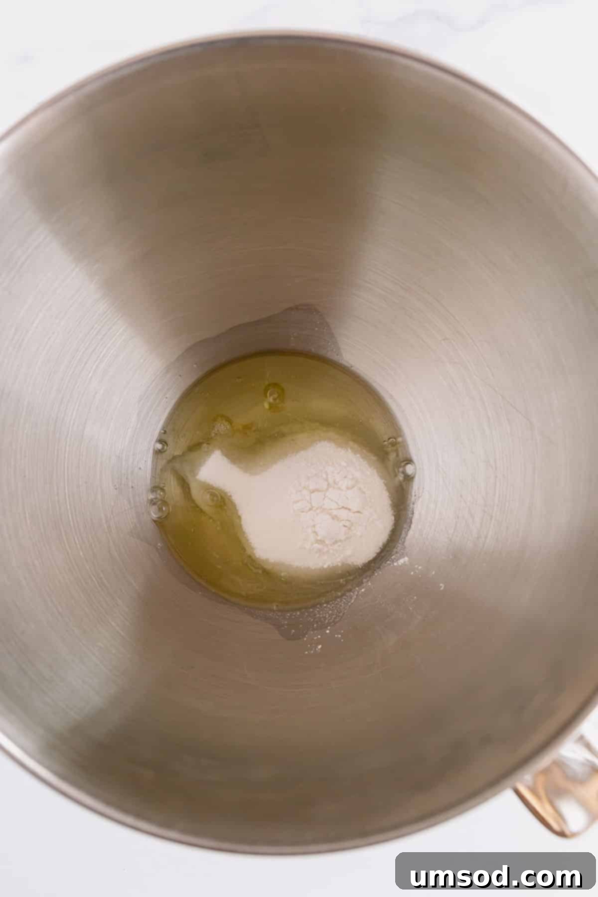 Cranberry Citrus Macarons 7 Egg whites, sugar, cream of tartar, and salt in a stainless steel mixing bowl.